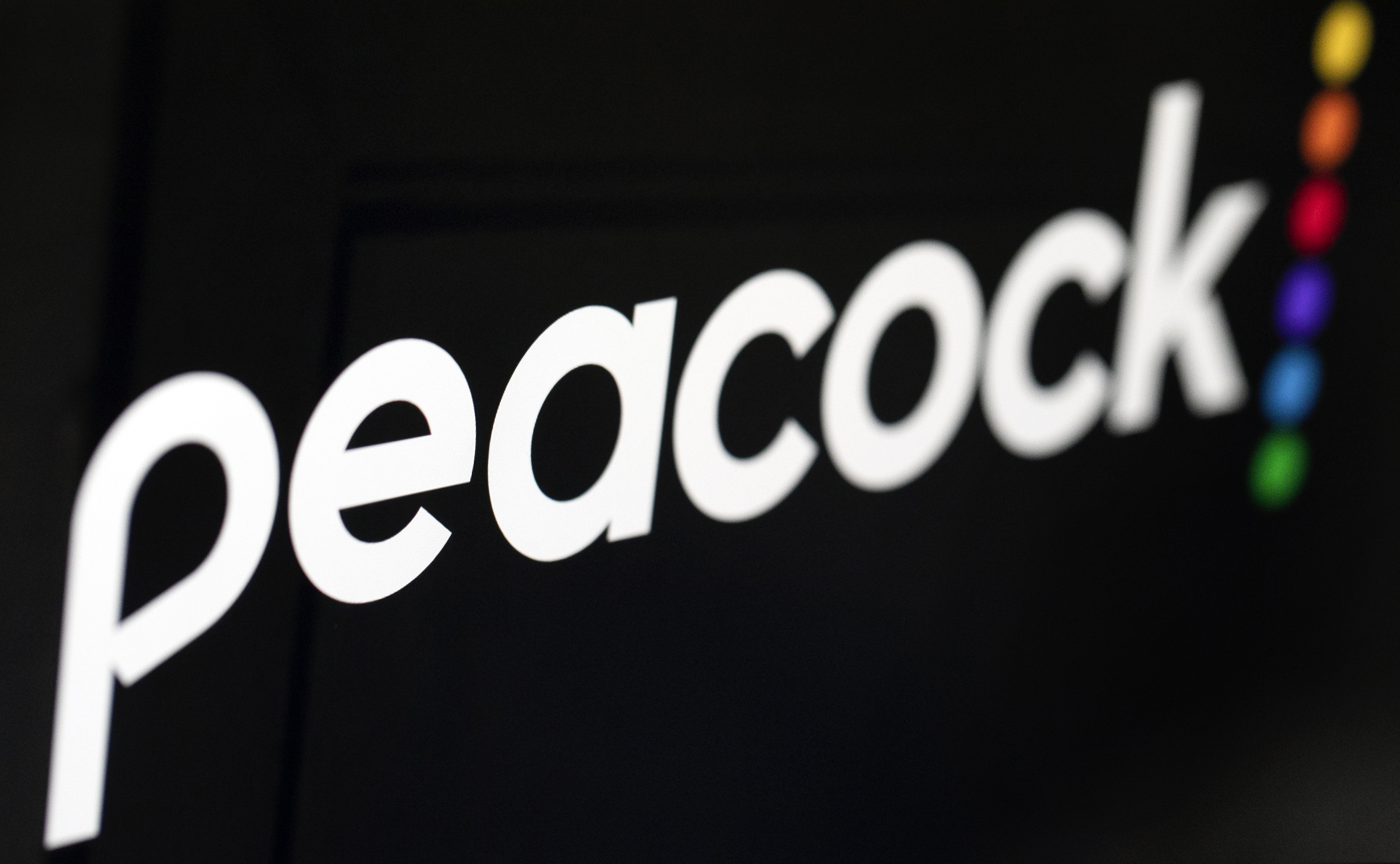 In this Jan. 16, 2020 file photo, the logo for NBCUniversal's upcoming streaming service, Peacock, is displayed on a computer screen in New York. (AP Photo/Jenny Kane, File)