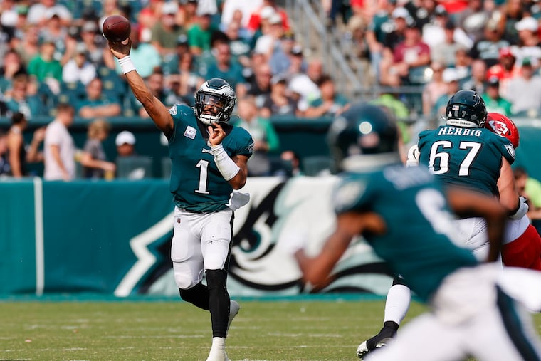 Eagles quarterback Jalen Hurts throws the football to teammate wide receiver DeVonta Smith against the Kansas City Chiefs on Sunday, October 3, 2021 in Philadelphia.
