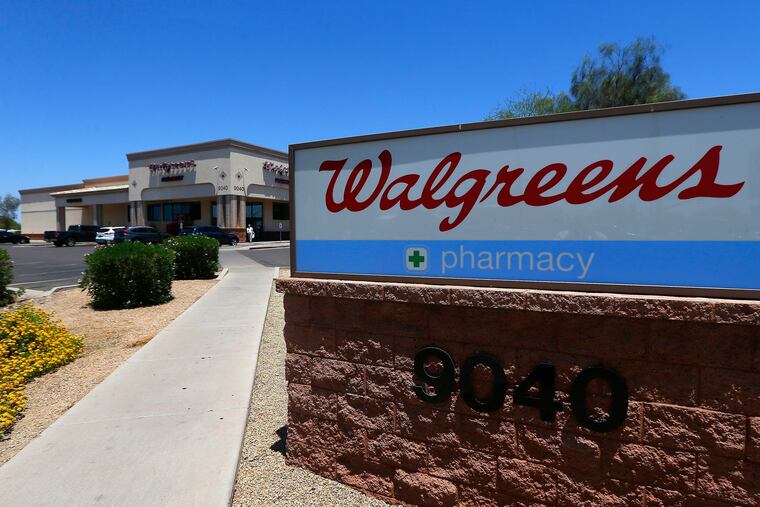 FILE- In this June 25, 2018, file photo shows a Walgreens store in Peoria, Ariz. Walgreens said Tuesday, Sept. 23, 2019, that it has decided to raise its minimum age for tobacco sales several weeks after a top federal official chastised the drugstore chain for violating laws restricting access to cigarettes and other products. (AP Photo/Ross D. Franklin, File)