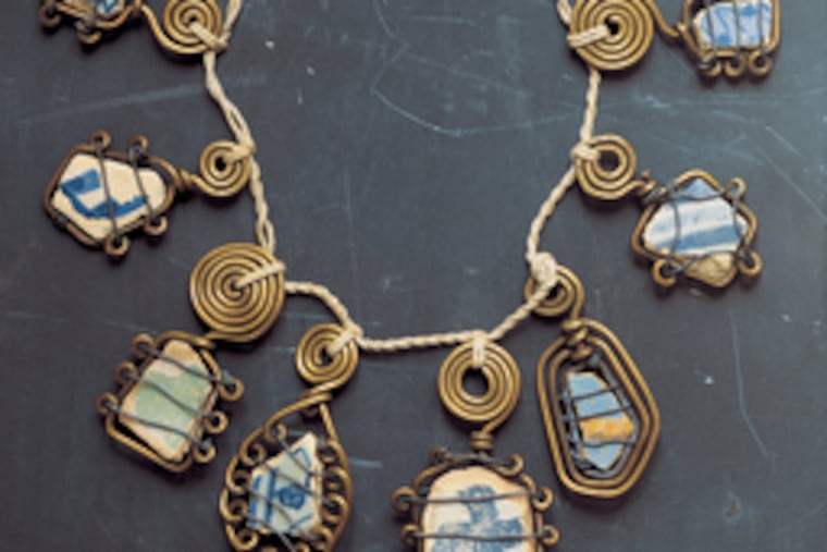 Above, a 1930 Alexander Calder necklace of brass wire, ceramic and string; below, his Harps and Heart necklace of brass wire, c. 1937. The exhibition is at the Philadelphia Museum of Art.