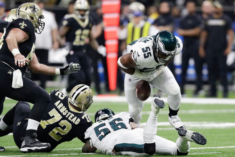 The football slips away from Brandon Graham after he sacked Drew Brees in the first quarter on Sunday and caused a fumble.