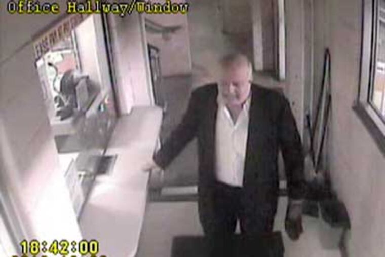 Surveillance showed John P. Wheeler III inside a parking garage appearing confused and disoriented hours before his body was dumped at a landfill. (AP Photo/Newark, Del. Police Dept. via The Wilmington News-Journal)