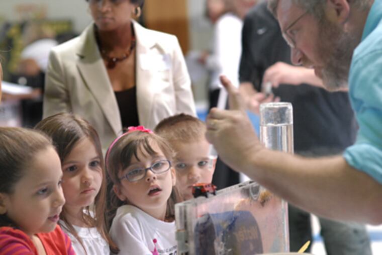 In Logan Township, students mark “Celebrating Afterschool: Outdoors in the Garden State,” a weeklong festival sponsored by New Jersey School-Age Care Coalition. Marc Rogoff, an environmental-education specialist, does a groundwater demonstration for the kids. (April Saul / Staff Photographer)