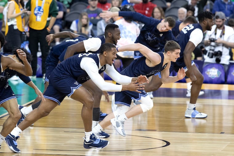 Villanova's Eric Dixon, left, and teammates take part in Friday's public Final Four practice.