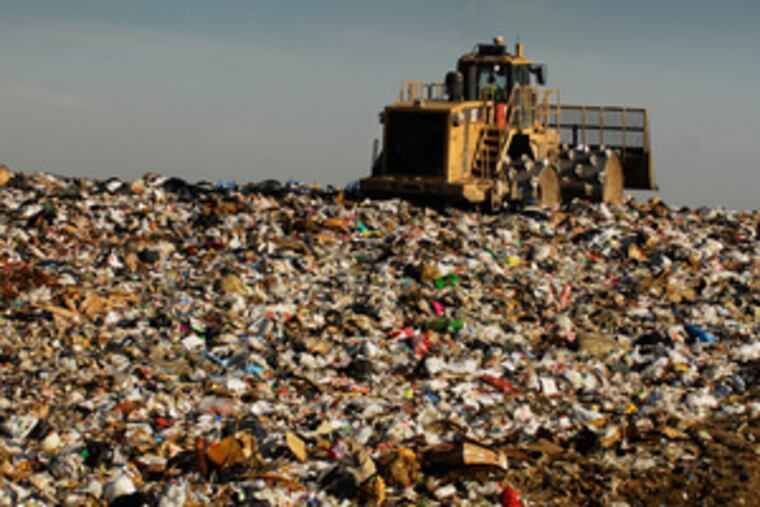 A compactor works on a section of the landfill, which has been expanded four times since Chester County acquired it in 1984 and is expected to reach its permitted capacity in 2013.