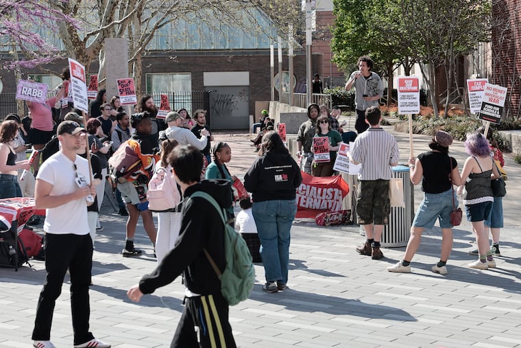 Darryl, a Temple freshman (at right), speaks to the group during the rally to protect the Cecil B. Moore Plaza skatepark in Philadelphia on Friday, April 10, 2026.