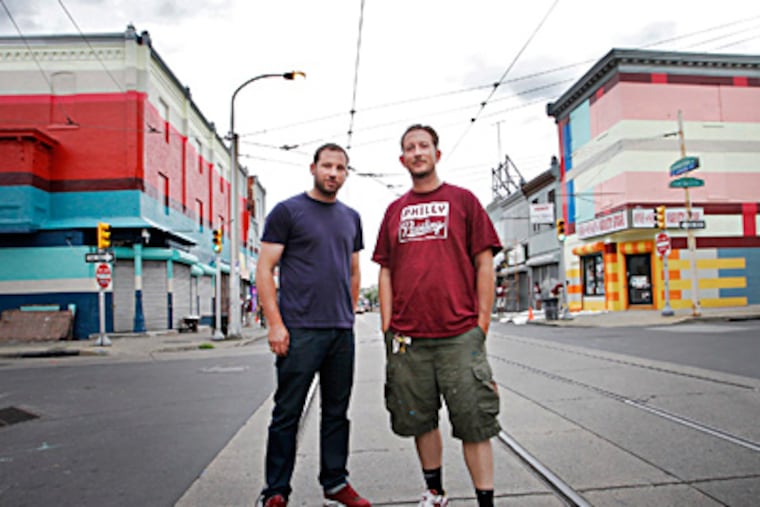 Dutch muralists Jeroen Koolhaas (left) and Dre Urhahn are leading the Mural Arts Program’s Philly Painting of geometric murals from the 2500 to the 2800 blocks of Germantown Avenue. The year-long project aims to marry art and economic development. ALEJANDRO A. ALVAREZ / Staff Photographer