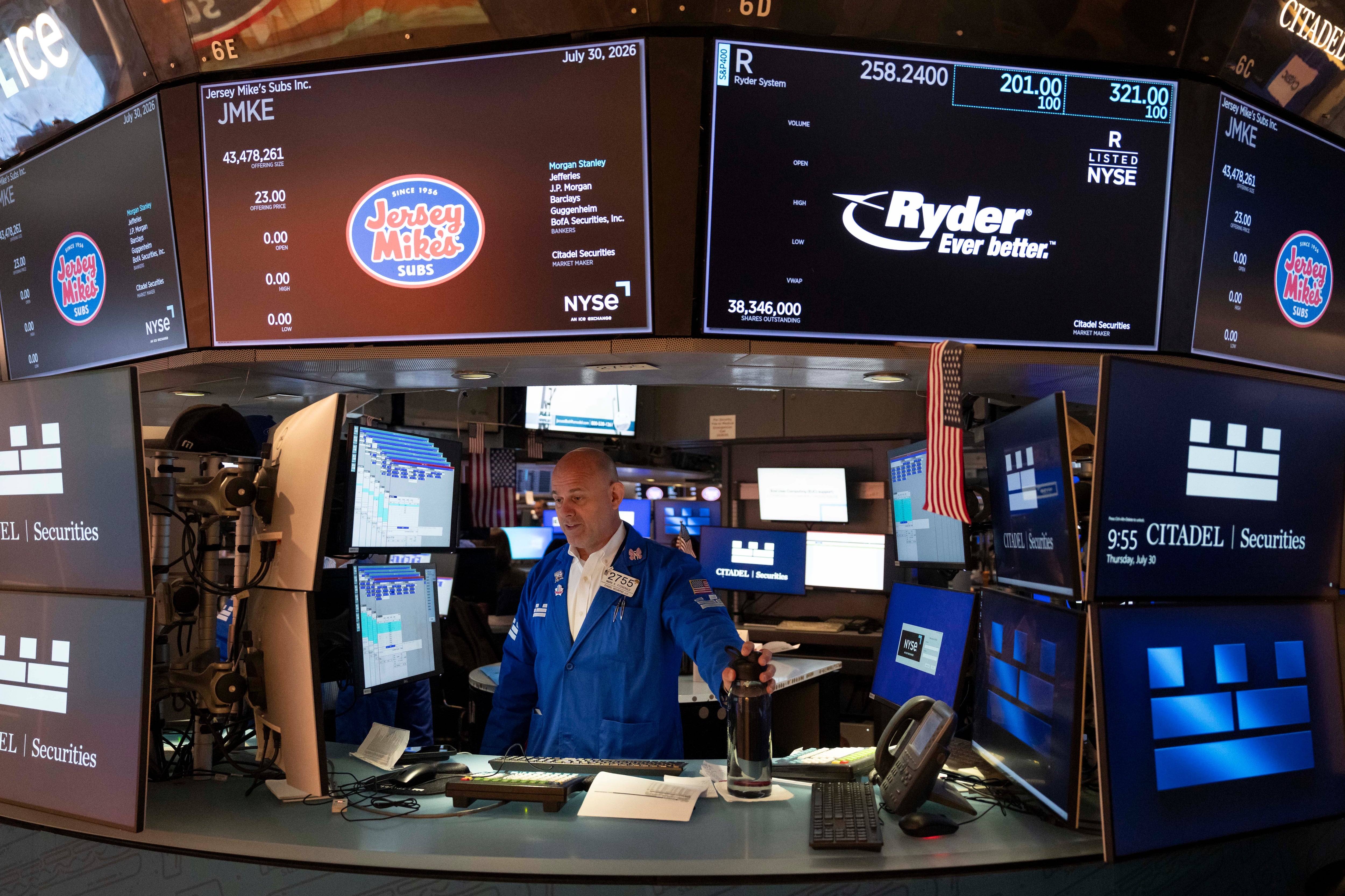 US stocks rally to finish a wild July as Amazon soars, Apple sinks and inflation worries worsen