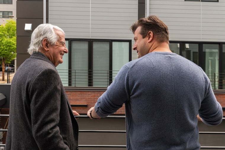 Cecil Baker talks to developer John Farina at 23 Logan in Fitler Square.