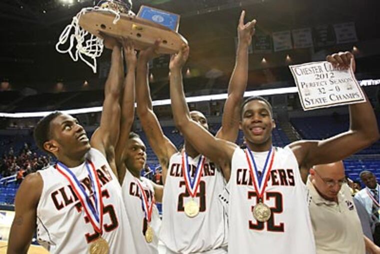Chester players celebrate their win over Lower Merion. (Steven M. Falk/Staff Photographer)
