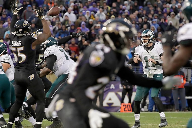 Eagles quarterback Carson Wentz watches his late two-point conversion pass get blocked against the Baltimore Ravens.