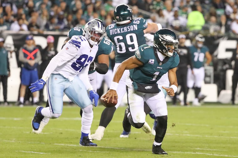 Philadelphia Eagles quarterback Jalen Hurts (1) scrambles as he looks to pass during a game against the Cowboys at Lincoln Financial Field in Philadelphia, Pa. on Sunday, October 16, 2022.