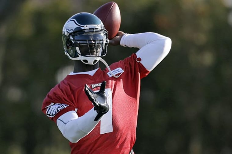 Eagles quarterback Michael Vick passes during practice at
the team's NFL football training facility, Wednesday, Dec. 19, 2012,
in Philadelphia. (AP Photo/Matt Rourke)