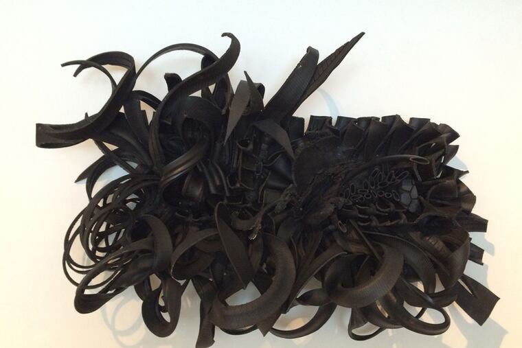 Chakaia Booker's sculpture, "Eminent Domain" (2010), rubber tires and wood steel frame.