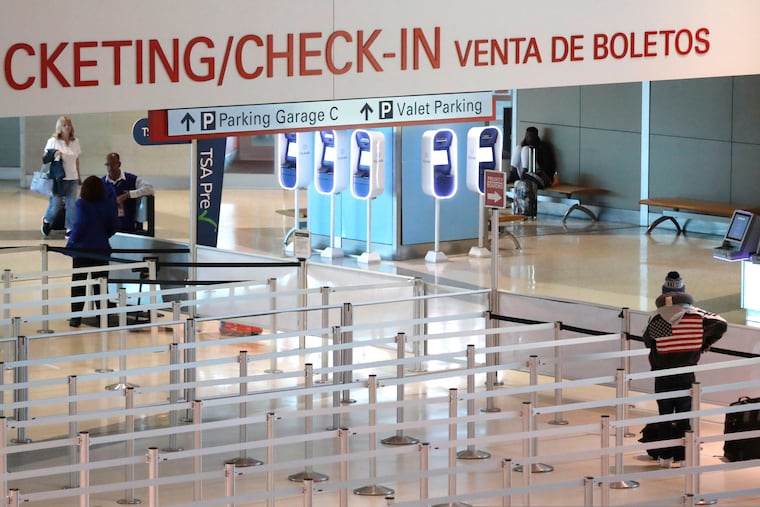 At Love Field airport in Dallas, an empty security queue awaits travelers. Some states, including Texas, have imposed quarantines on travelers from coronavirus hotspots in the United States.