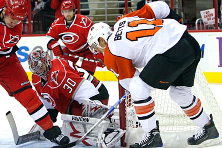 Blair Betts tries to score against Hurricanes goalie Cam Ward during a game earlier this month. (AP Photo/Gerry Broome)
