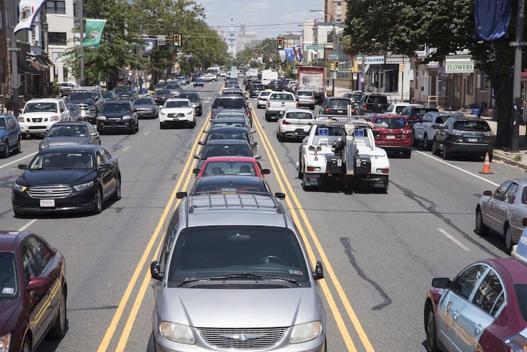 Cars parked in the median of South Broad Street between Shunk and Porter Streets.
