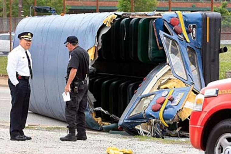 A bus overturned at 2845 E. Westmoreland St. in Port Richmond Section. There were 22 day workers coming back from Belmar, NJ. on the bus. (AKIRA SUWA / Staff Photographer)