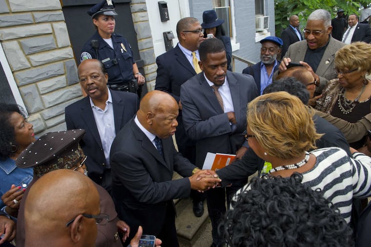 Civil right icon and U. S. Rep. John Lewis is surrounded by admirers during his visit Monday to Walnut Street in Camden at the house where the Rev. Dr. Martin Luther King Jr. lived when he was a student at Crozer Theology Seminary in the 1950s.