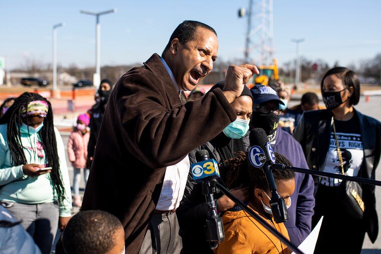 Terence Jones, a former Philadelphia police officer, introduces the wife and son of Lymond Moses and speaks to press about Moses' fatal shooting by New Castle County police at a protest on Feb. 5.
