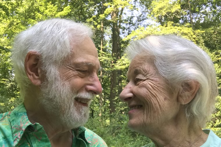 Al and Gwen Gilens in their wooded backyard.