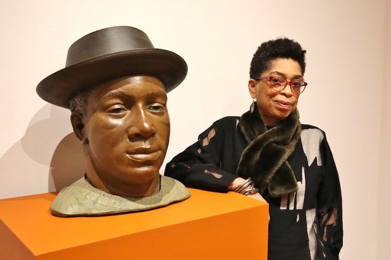 Syd Carpenter with a bust of her brother Frank, one of the sculptures in the Woodmere Museum's show “Syd Carpenter: Planting in Place, Time, and Memory"