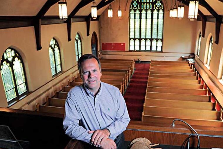 D. Scott Brehman, 51, a partner in Main Line reBUILD, is in the choir loft of an old Baptist Church in Ardmore which his company is going to repurpose into four housing units each about 2500 square feet. Photo taken July 30, 2014. ( CLEM MURRAY / Staff Photographer )