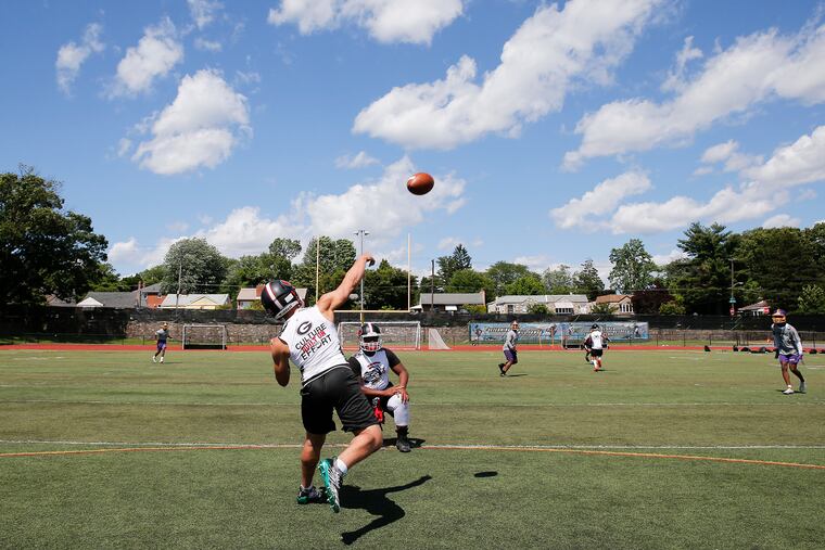 Gratz High School's Rodneil Passapera throwing the ball against King during a 7-on-7 football tournament in June. The 7-on-7 game is gaining traction in Philadelphia.