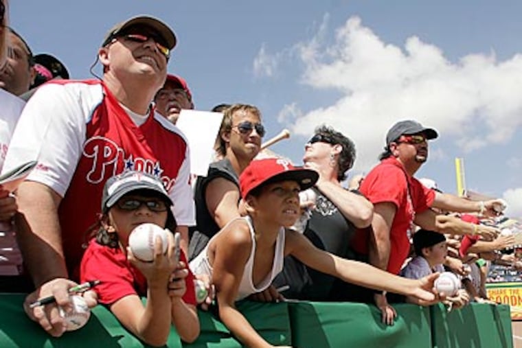 Phillies fans await autographs before a spring training game in Clearwater, Florida. (Yong Kim/Staff Photographer)