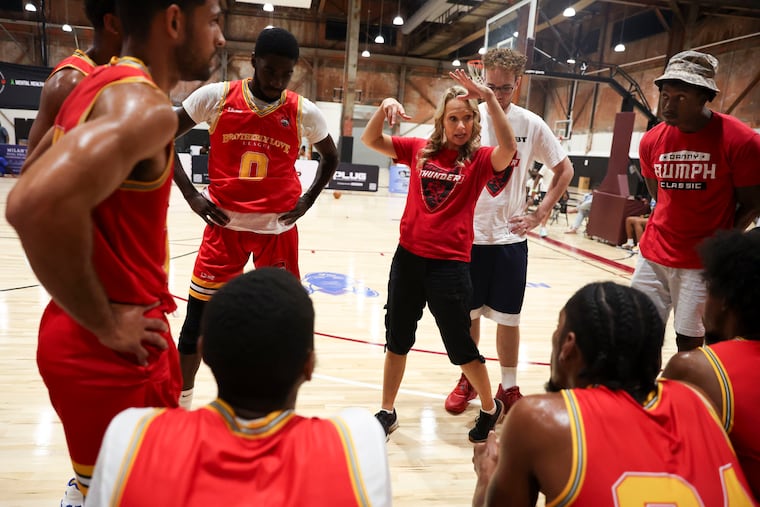 Red Rose Thunder coach Malin Morrison (center) with her son, Lucas Morrison, standing nearby during a Brotherly Love Pro-Am Summer League game on July 16. Lucas Morrison is the team's general manager, and the team is preparing to compete in The Basketball Tournament.