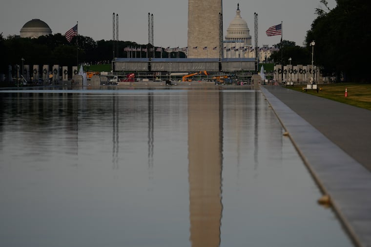 The U.S. Capitol and the Washington Monument are reflected in the Lincoln Memorial Reflecting Pool Thursday, June 25.