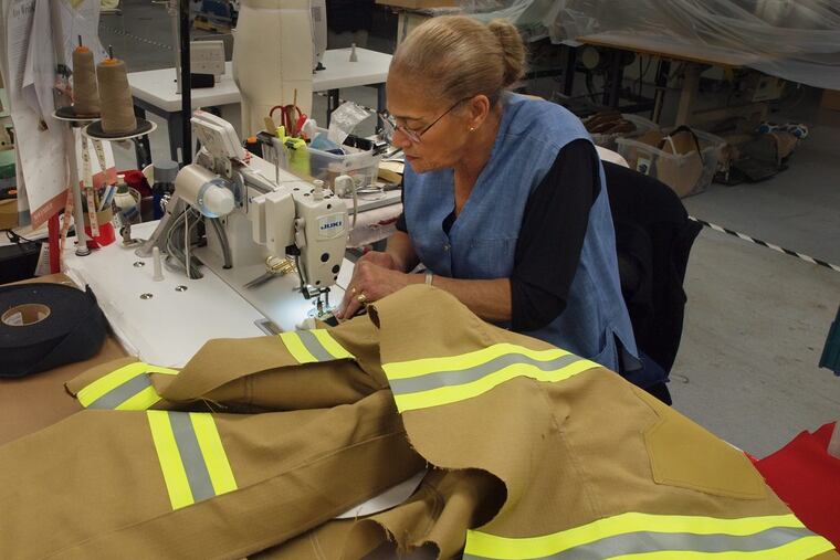 Argentina Feliciano is among nearly 40 sewing-machine operators at Ricochet Manufacturing Co., which expects to hire at least another 30 as a result of its new contracts to provide protective clothing to Air Force firefighters.