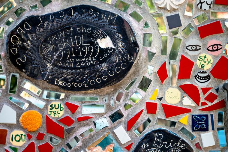 Organizers and volunteers from Magic Gardens chip away trying to save pieces of the iconic Isaiah Zagar mosaic on all the exterior walls of the former Painted Bride. After years of uncertainty and legal battles, the building is coming down and they are working to preserve some of the artists' work before it is razed and converted into short-term rentals.
