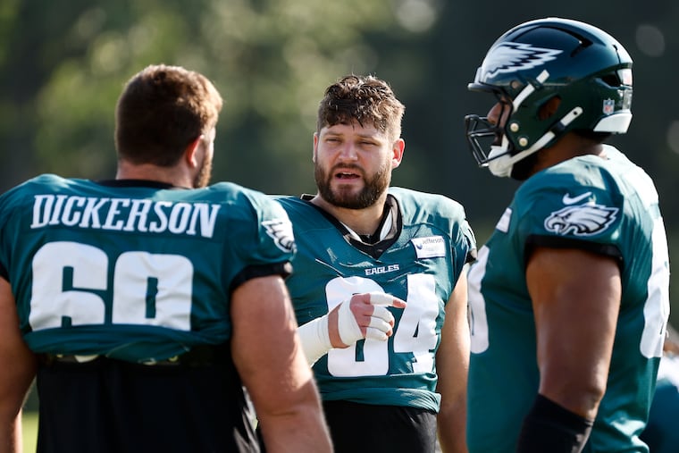 Philadelphia Eagles guard Landon Dickerson talks with offensive tackles Brett Toth and Jordan Mailata during training camp at the NovaCare Complex on Tuesday, July 29, 2025 in Philadelphia.