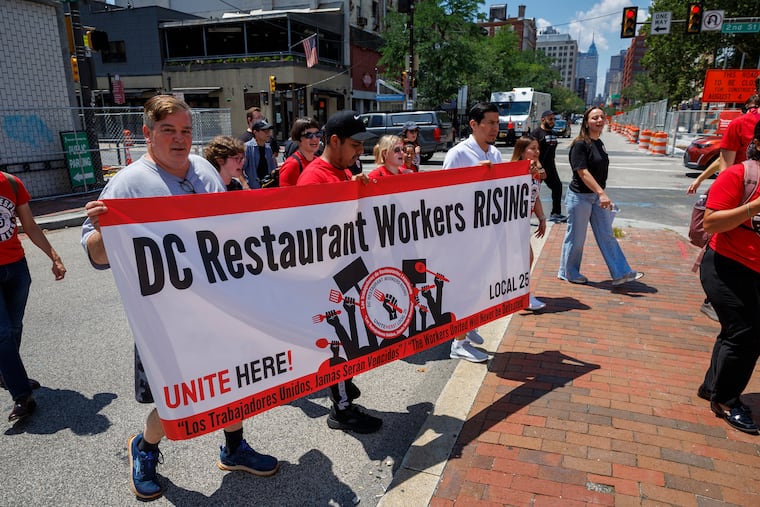 Employees of Stephen Starr restaurants from Washington, D.C., came to Philadelphia to protest outside Starr headquarters at 134 Market St. as they work to unionize.