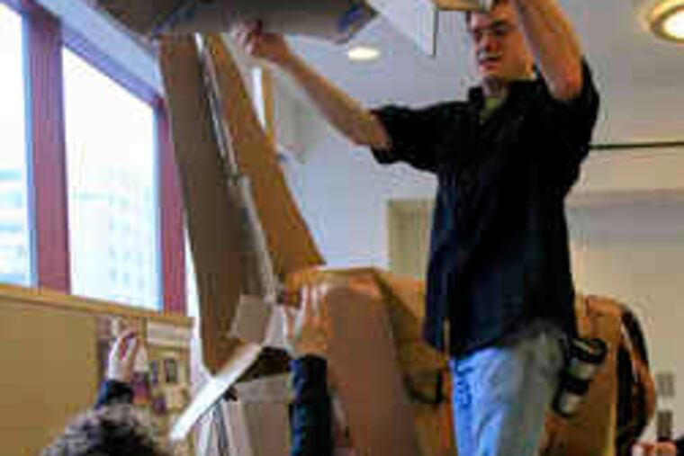 Students at Pennsylvania Academy of the Fine Arts dismantle a horse dropped off by a class at Temple University's Tyler School. The Tyler class left horses at three other art schools as well.