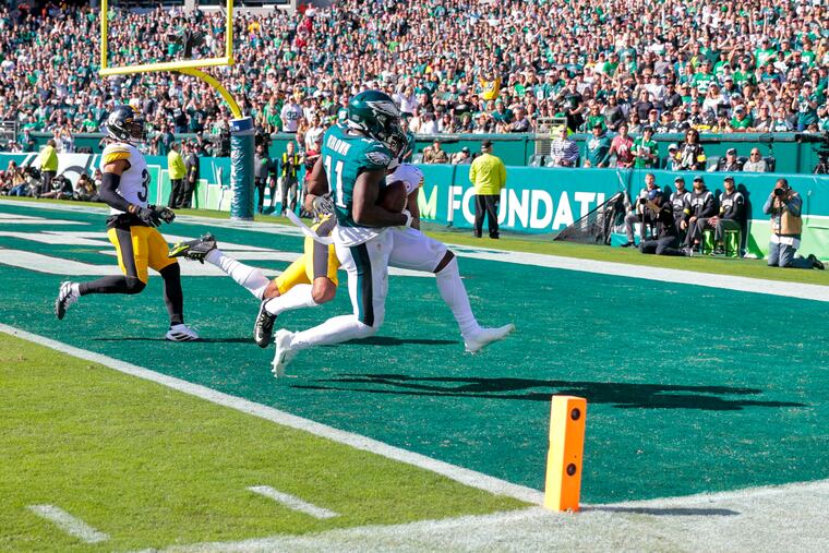 Eagles wide receiver A.J. Brown catches a pass from Jalen Hurts for a 27-yard touchdown against the Pittsburgh Steelers.