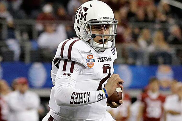 Texas A&M quarterback Johnny Manziel finds open running room against Oklahoma in the second half of the Cotton Bowl NCAA college football game Friday, Jan. 4, 2013, in Arlington, Texas. (Tony Gutierrez/AP)
