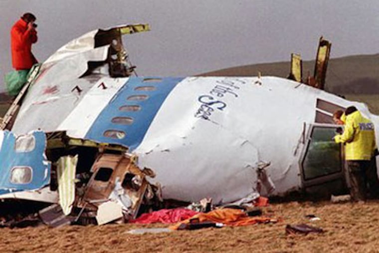 Investigators examining the wreckage of the flight deck of Pan Am 103 in 1988. (AP file photo)