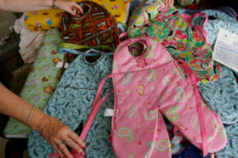 Handmade bibs designed to keep babies cleaner became a small business for two local women in a growing trend. Story tomorrow.