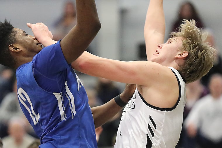 Paul VI's Jordany Pierre (left) battles Bishop Eustace's William Humer in the second period on Saturday. Pierre ended with 14 points.