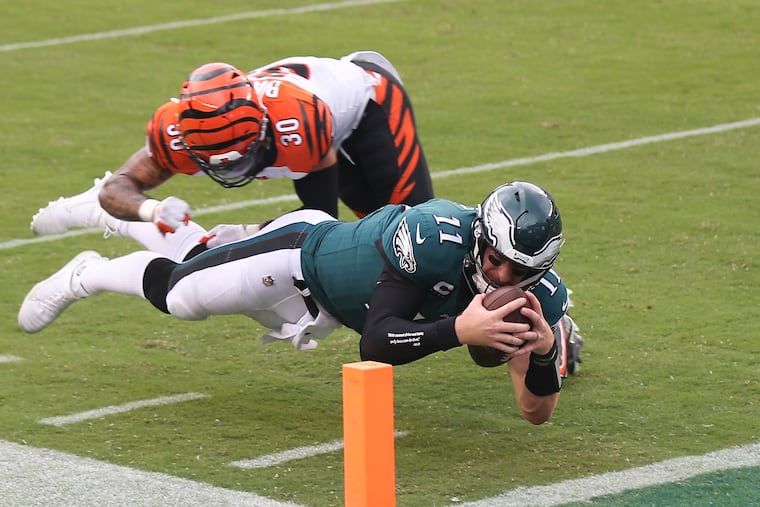 Eagles quarterback Carson Wentz did a much better job of running with the football Sunday than he did throwing it.