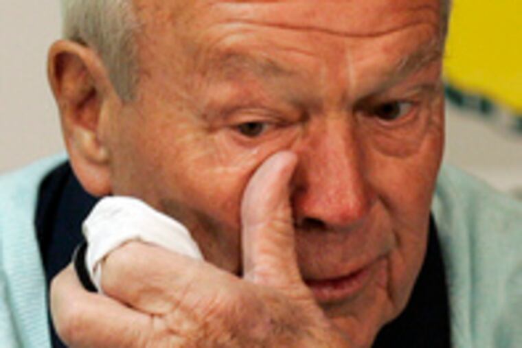 Arnold Palmer wipes a tear at news conference after ceremonial first tee shot.