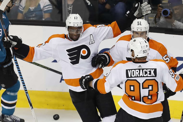 The Flyers' Wayne Simmonds (17) celebrates with teammates Valtteri Filppula (51) and Jakub Voracek (93) after scoring a goal against the San Jose Sharks, Wednesday, Oct. 4, 2017.