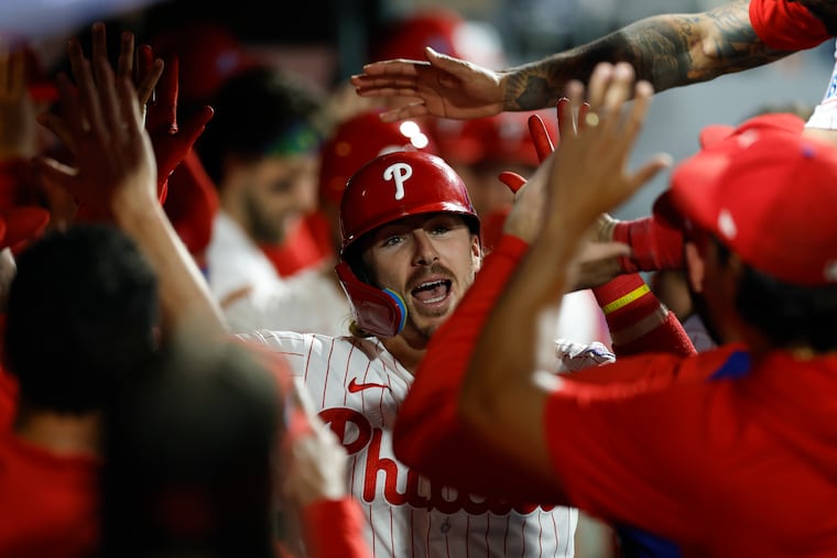 Bryson Stott celebrates his eighth inning two-run home run with is teammates against the Cincinnati Reds on Monday.