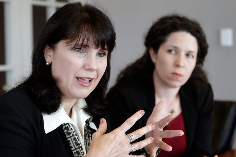 Lawyers Gina Maisto Smith (left) and Leslie Gomez have been working together since their days in the District Attorney’s Office. A colleague praises their “laserlike commitment.”