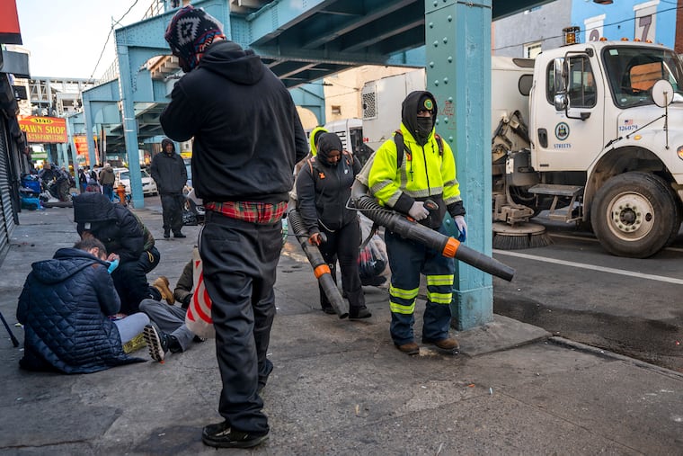 City workers cleaned streets along Kensington Avenue in February 2024. The neighborhood was the recipient of millions in opioid settlement funds, but some programs were rejected by the powerful state trust that reviews how the money is spent. The city is appealing the decision.