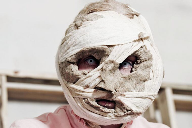 Gabriela Fridriksdottir, the Icelandic artist, in a self-portrait with her head wrapped in gauze and bread dough, from her 2006 project, "Inside the Core," at Moore College of Art & Design.