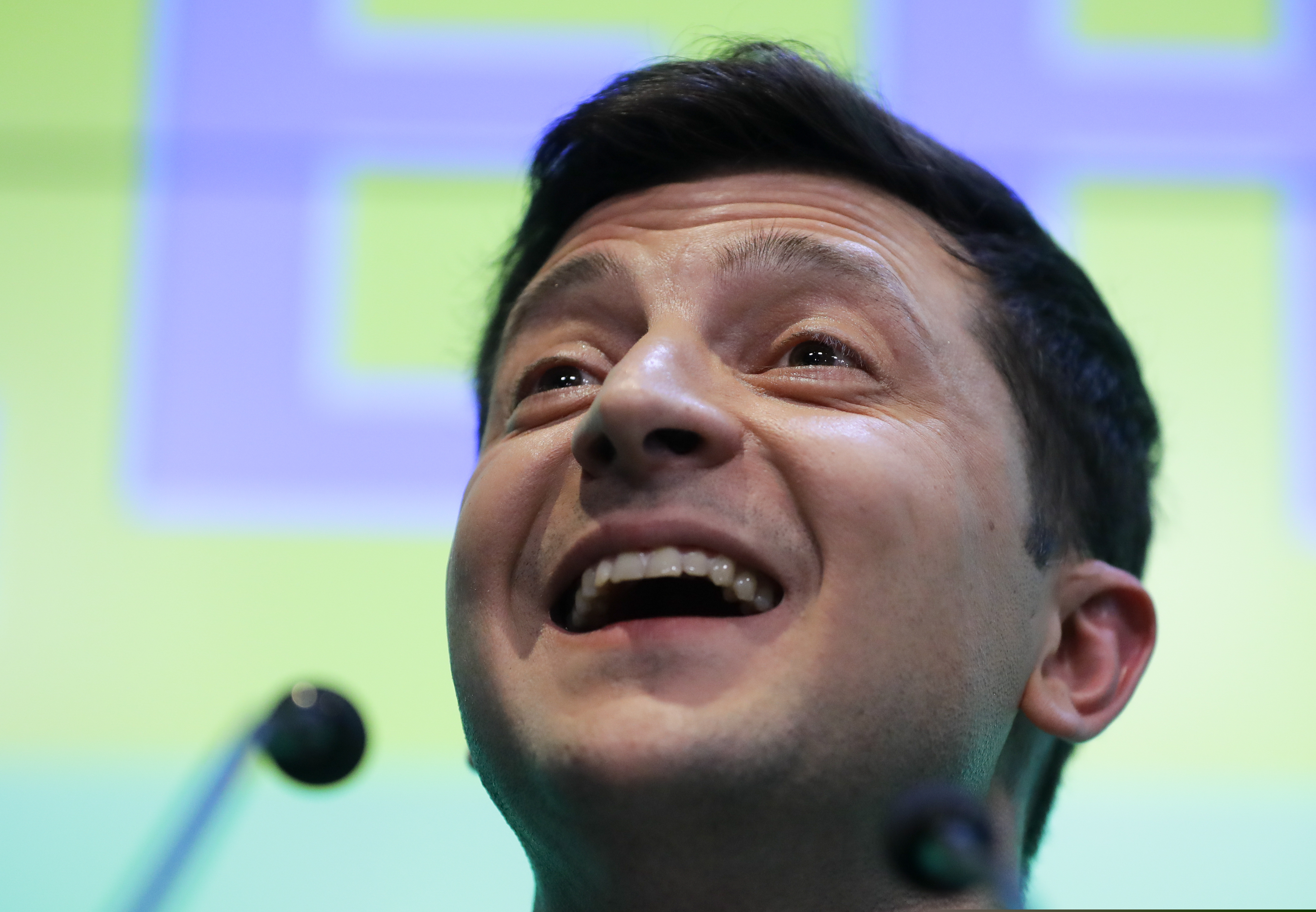Ukrainian comedian and presidential candidate Volodymyr Zelenskiy speaks to the media and his supporters at his headquarters after the second round of presidential elections in Kiev, Ukraine, Sunday, April 21, 2019. A comedian whose only political experience consists of playing a president on TV appeared poised to reprise the role in real life when an exit poll showed him winning Ukraine's presidential runoff Sunday in a landslide. (AP Photo/Sergei Grits)