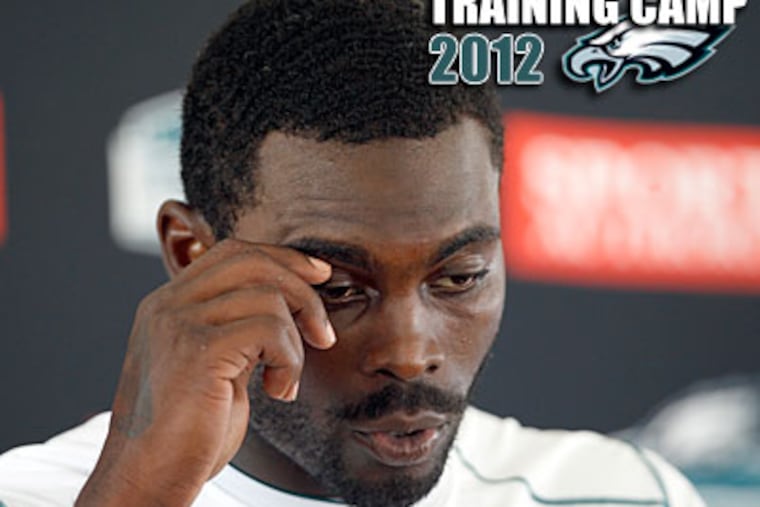 Michael Vick tears up while giving a statement on Garrett Reid's death. (David Maialetti/Staff Photographer)